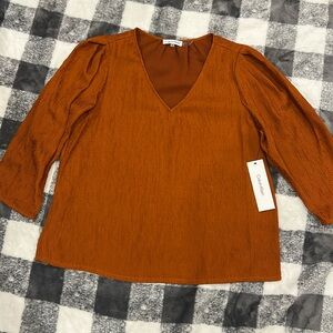 BRAND: Calvin Klein
COLOR: Orange
SIZE: medium 
CONDITIONS: Brand new